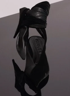 MUGLER black leather knot fang flat mules